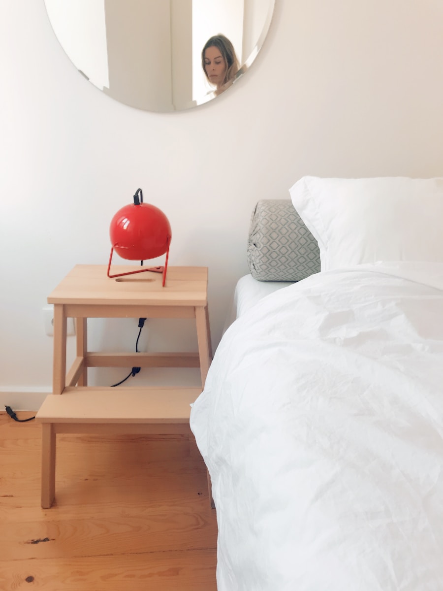 round red corded appliance on brown side table